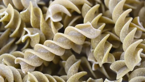 Green pea fusilli spirals shifting in close up food composition Stock Footage 331590541