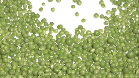 Green pea. The young peas drop on the table and roll. Stockbeeldmateriaal 78023751