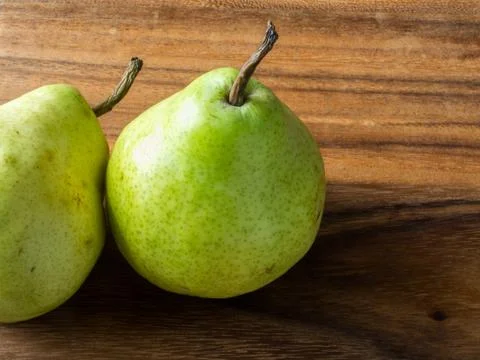 Green Pears on Board Stock Photos