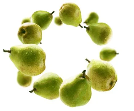 Green pears levitate on a white background Stock Photos