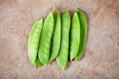 Green peas on ceramic surface Stock Photos