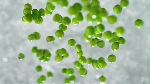Green Peas Falling into Pot of Boiling Water Stock Footage 271399602