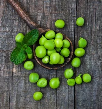 Green peas on a table Stock Photos