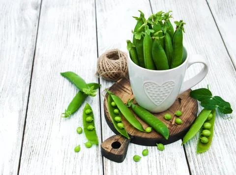 Green peas on a table Stock Photos
