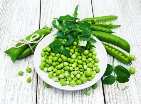 Green peas on a table Stock Photos