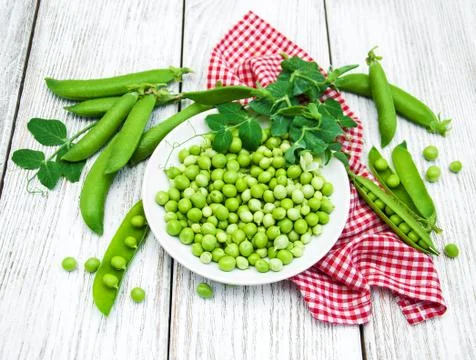 Green peas on a table Stock Photos