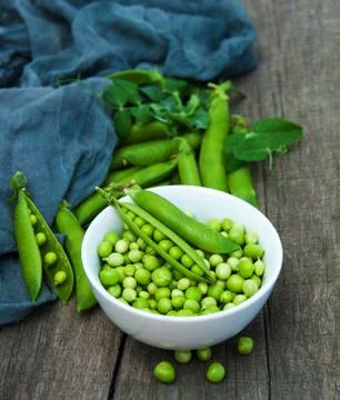 Green peas on a table Stock Photos