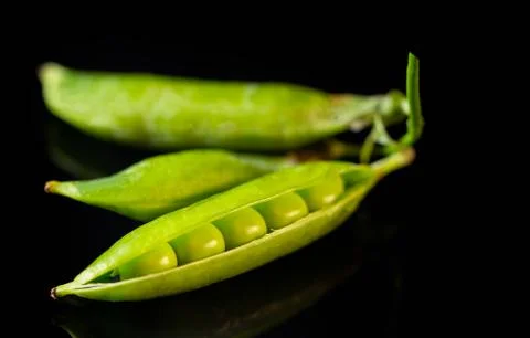 Green peas on the table Stock Photos