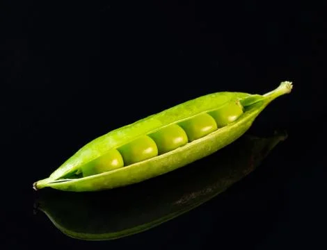 Green peas on the table Stock Photos