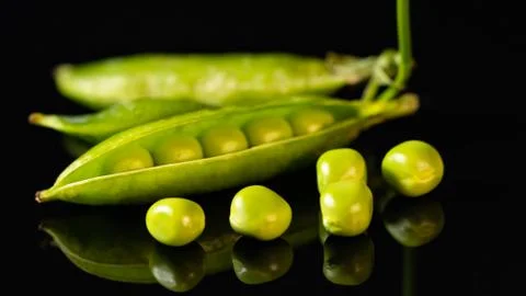 Green peas on the table Stock Photos