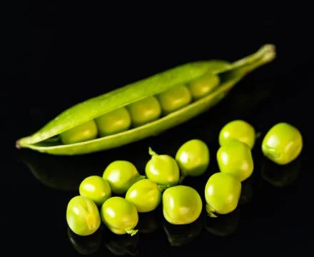 Green peas on the table Stock Photos