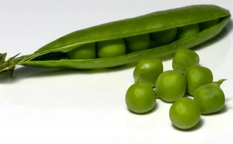 Green peas on the table Stock Photos