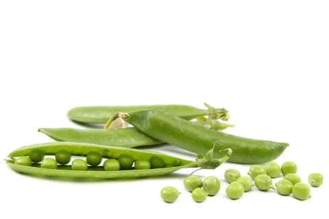 Green peas on a white background. Stock Photos