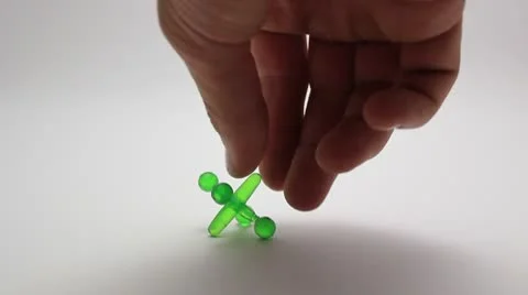 Green Peg top spinning Stock Footage 8920434