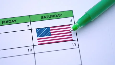 A green pen points to the Independence Day date of July 4th  Stock Footage 338025418