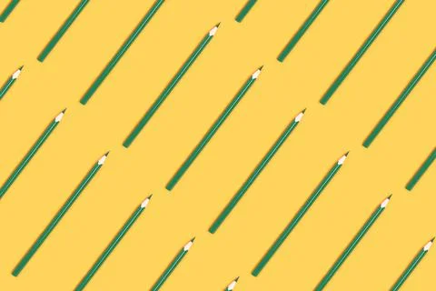 Green pencil pattern on a yellow background. 스톡 사진