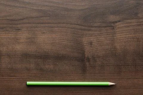 Green pencil on the table Stock Photos