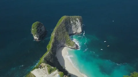 Green peninsula in dragon shape in the ocean with the turquoise ocean waves Stock Footage 101666117
