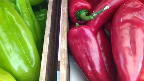 Green pepper and red bell pepper to choose from for salad and cooking healthy Stock-Footage 306570023