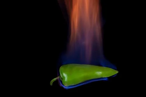 Green pepper on fire Stock Photos