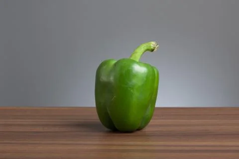 Green pepper, raw, on table Stock Photos