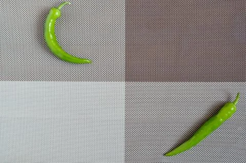 Green pepper on a rectangular background of gray, brown and white Stock Photos