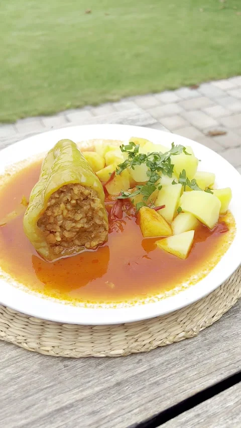 Green pepper stuffed with minced meat and rice in tomato sauce. Stock Footage 248465319