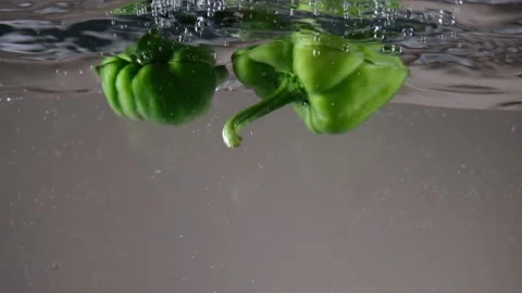 Green pepper in water Stock Footage 197018241
