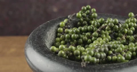 Green peppercorns closeup rotating selective focus Stock Footage 164772560