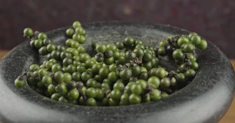 Green peppercorns closeup rotating selective focus Stock Footage 166723465