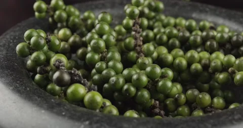 Green peppercorns closeup rotating selective focus Stock Footage 166723523