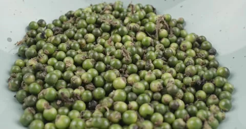Green peppercorns closeup rotating selective focus Stock Footage 168308639