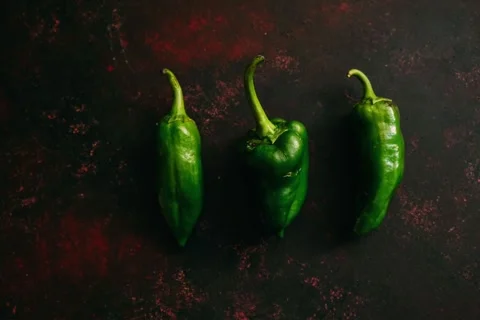 Green peppers, stop motion animation on dark background 4k Video stock 260908024