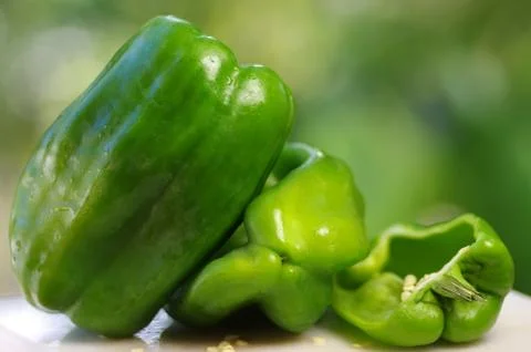 Green peppers on table Stock Photos