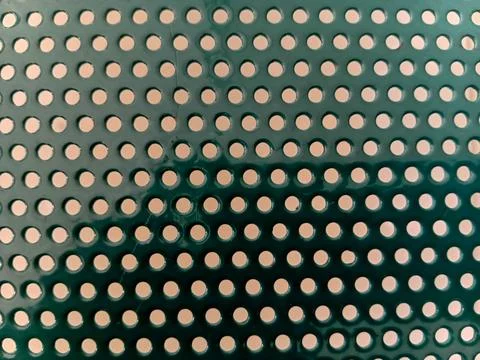 Green Perforated Metal Pattern Background Foto stock