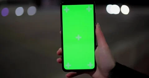 Green phone screen on the background of driving cars Video stock 146482697