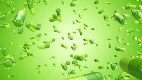 Green pills constantly falling. Stock Footage