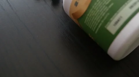 Green Pills on the Table Stock Footage 40608745