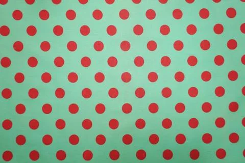 Green with pink polka dot pattern background 库存照片