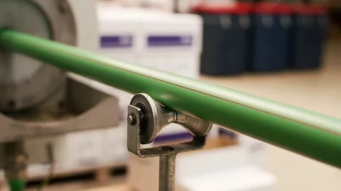 Green Pipe Through Metal Guide Roller, Industrial Warehouse Setting Video stock 342283274