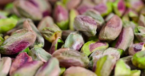 Green pistachios peeled from the shell, salted crunchy nuts, pistachios without Stock Footage 305664659