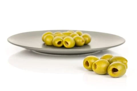 Green pitted olive fruit isolated on white Foto stock