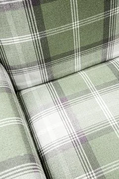 Green plaid fabric surface presenting a classic tartan pattern, creating a .. Stock Photos