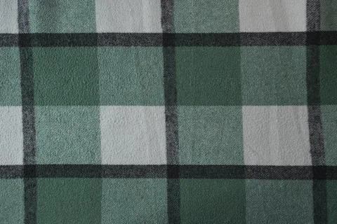 Green plaid fabric texture with repeating check pattern Stock Photos