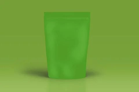 Green plastic bag on light green background Foto stock