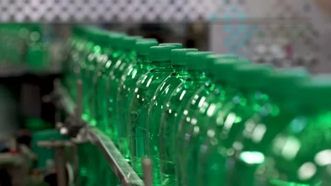 The Green Plastic Bottles On The Conveyor Pouring Of Drinking Water Stock Footage 87090645