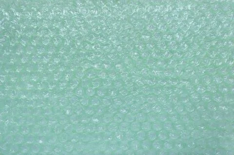Green plastic bubble wrap texture background, Polyethylene bubble wrap Stock Photos
