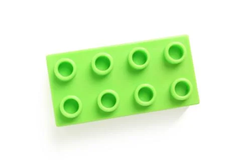 Green plastic building block on white background Stock Photos