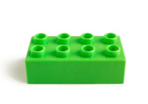 Green plastic building block on white background Stock Photos
