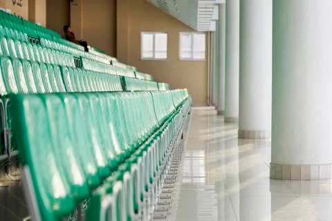 Green plastic chairs in the building Stock Photos